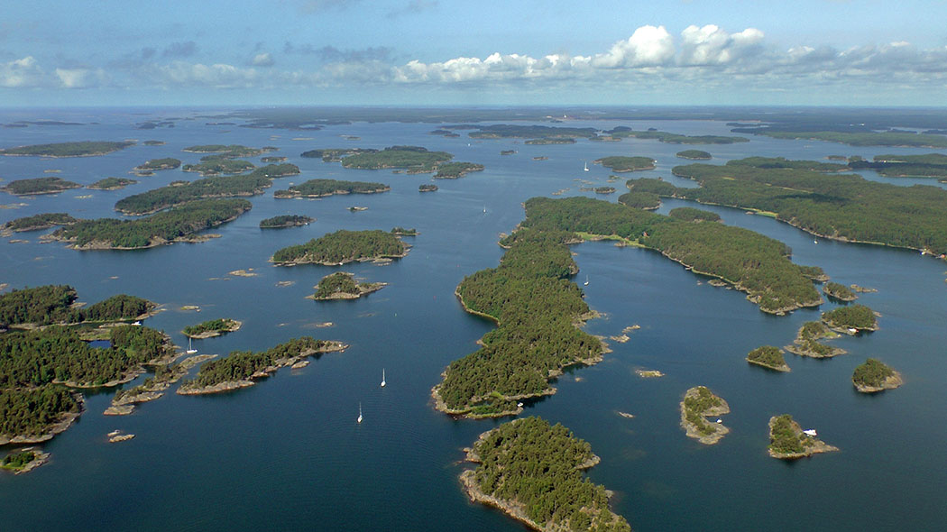 Aerial picture. Islets, sea and boats in the Tammisaari Archipelago National Park.