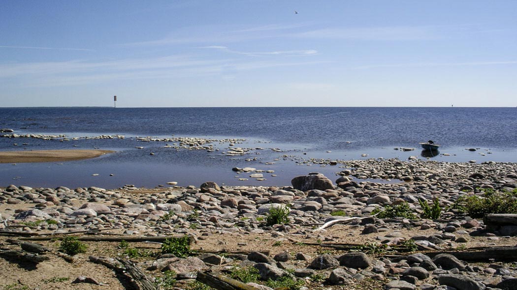 Marine landscape from Bothnian Bay. Beach pebbles in front.