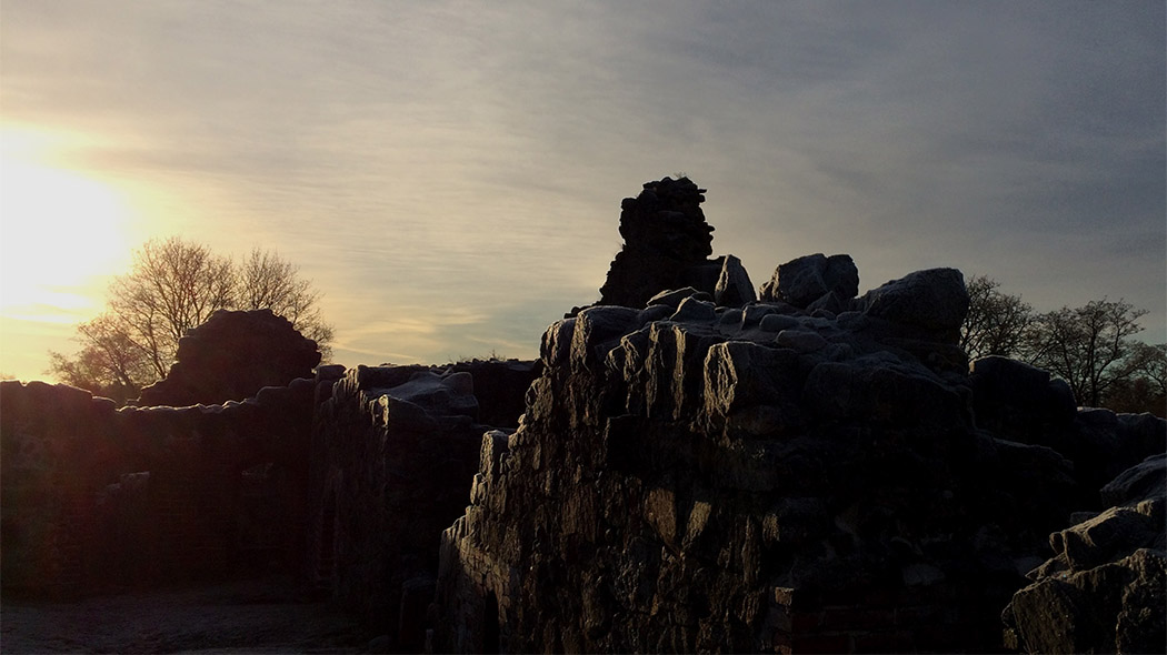 Evening sun over castle ruins.